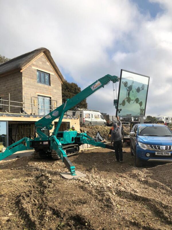 mechanical lifter carrying glazing for installation