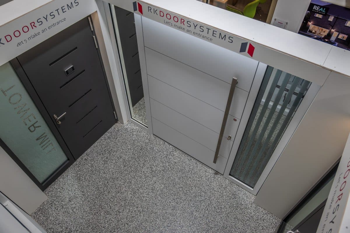 Designer RK pivot doors and hinged aluminium front doors in the CBP showroom shown from above.