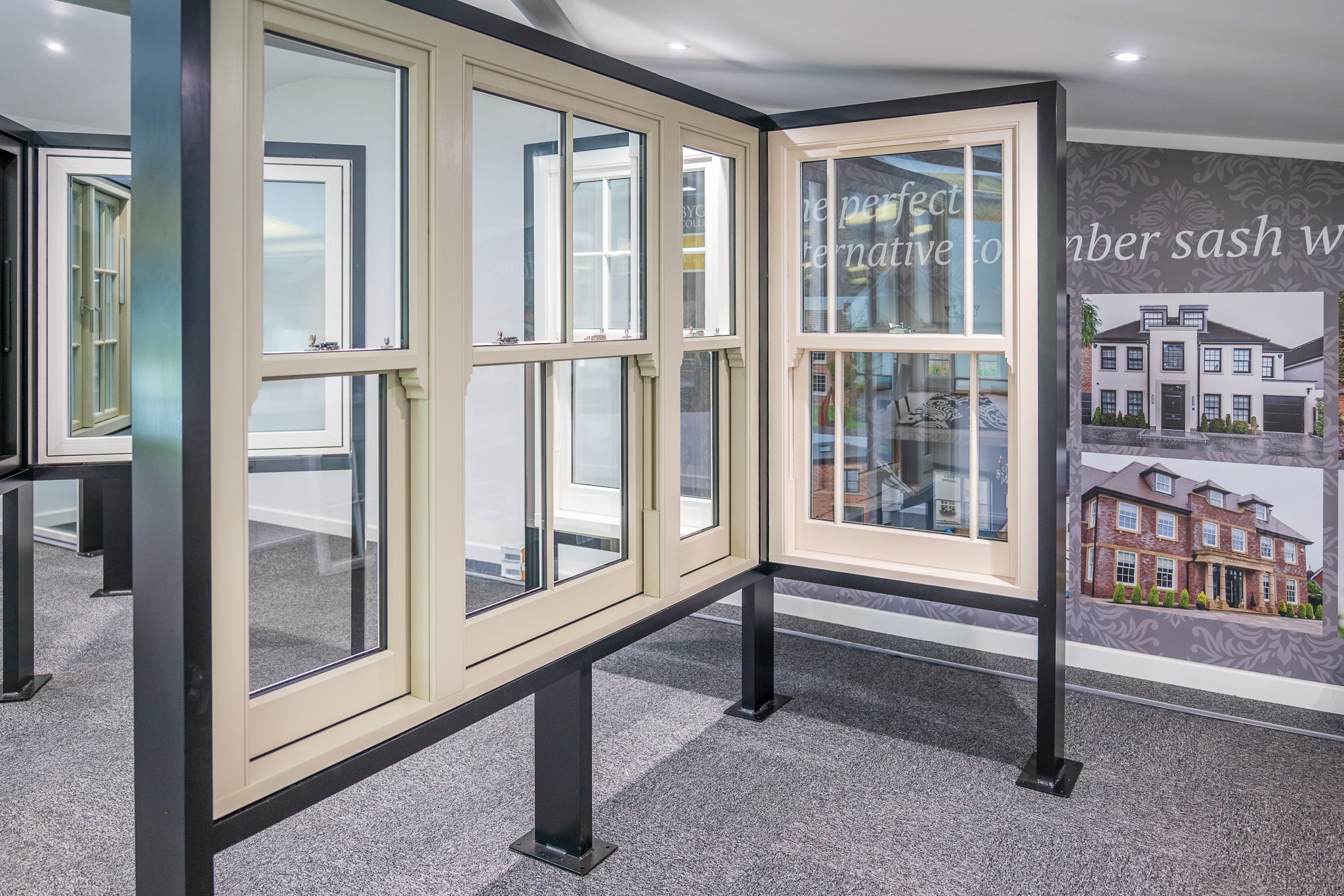 Showroom display stand with the Masterframe bygone sash window product range on display