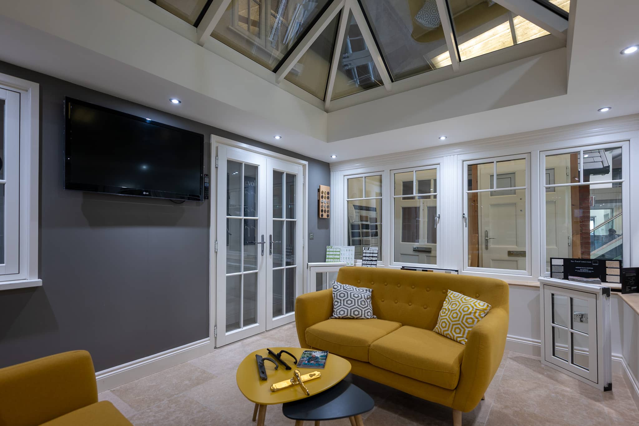 Indoor showroom at CBP in wiltshire showing a conservatory orangery with Evolution timber-alternative windows and doors