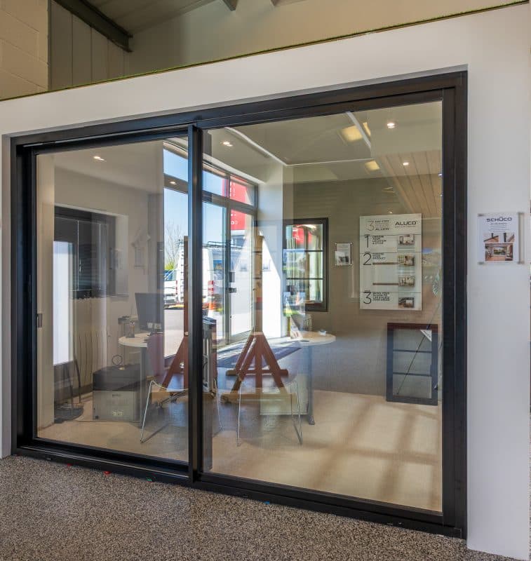 Contemporary Chalet Home in Somerset with Schüco Patio Doors 5 black Schüco ASE51 PD sliding door in the CBP showroom