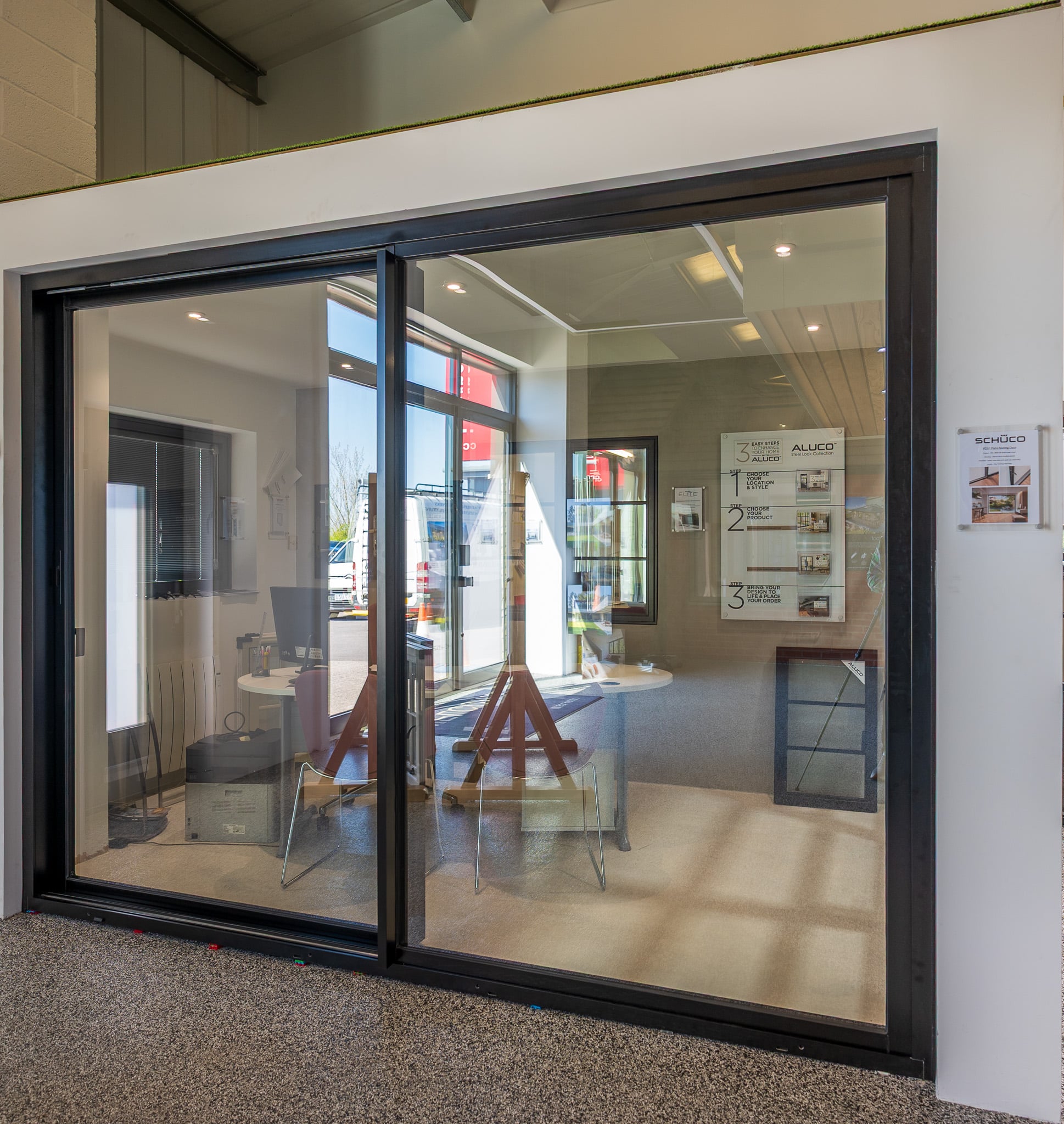 black Schüco ASE51 PD sliding door in the CBP showroom