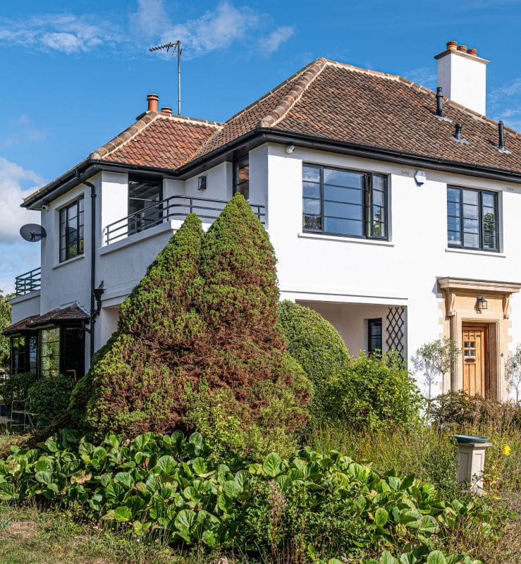 outside view of art deco house with steel look windows and doors