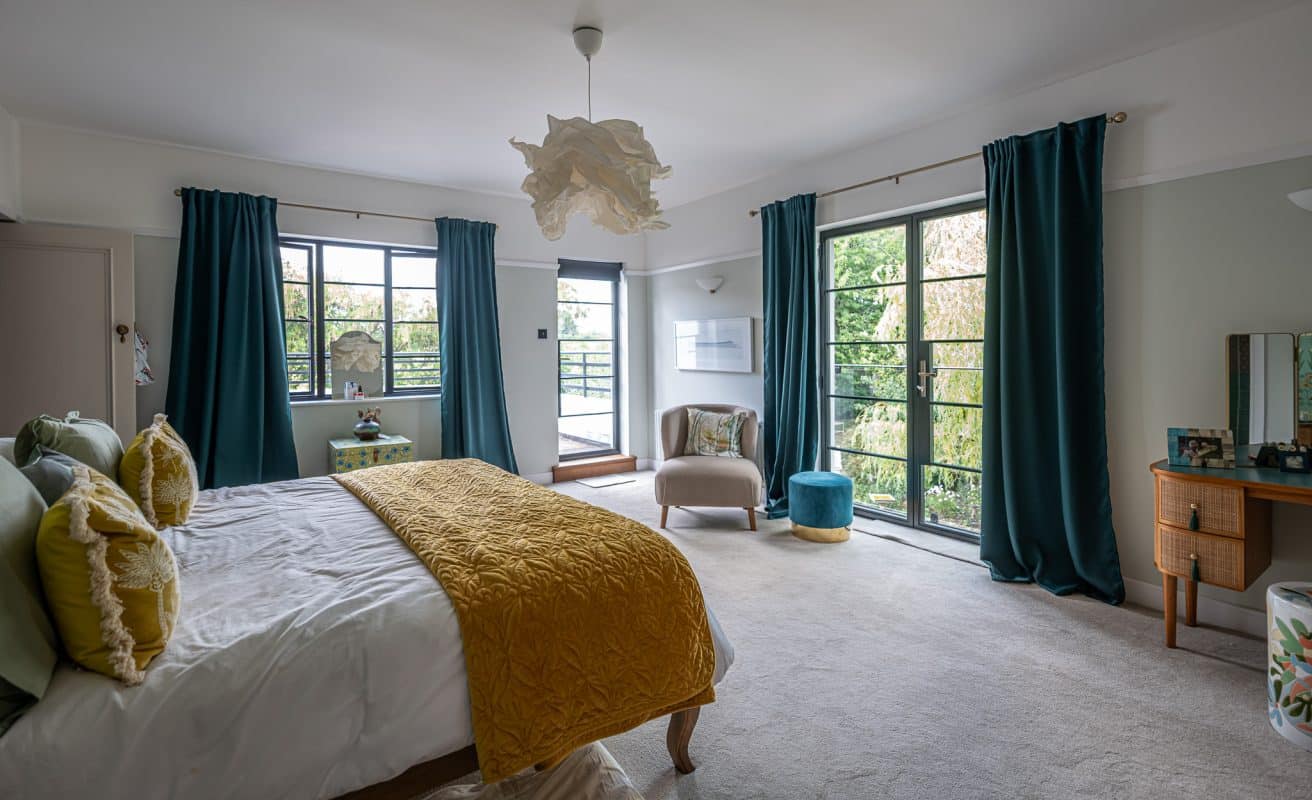 stylish bedroom suite with steel look black Aluco French doors and windows