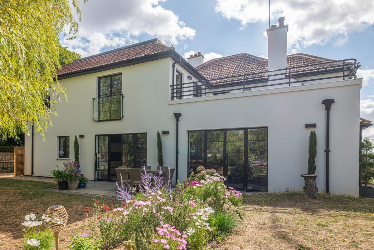 picture of period home with new double story extension showcasing Aluco Elite steel look doors