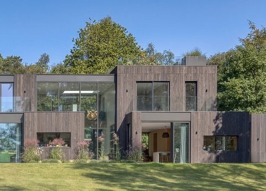 Smart Systems MC600 curtain walling in a modern surry mansion with extensive lawns