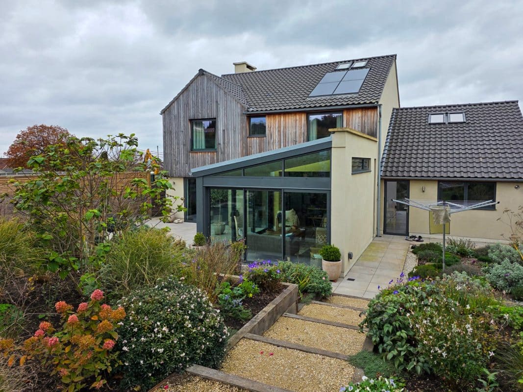 Alitherm Windows and Visoglide Sliding Doors for a Bristol New Build 12 alitherm aluminium windows in a raked head design above sliding doors in a new build home.