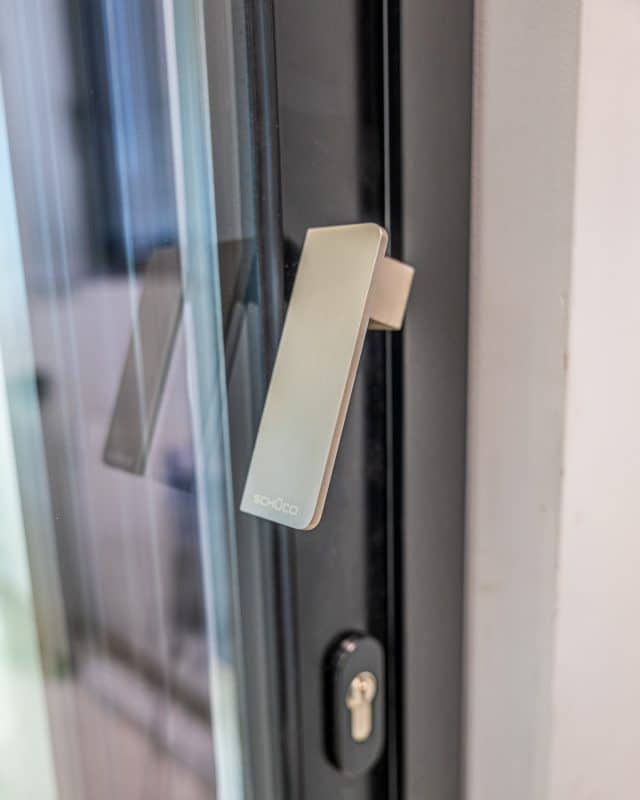 Contemporary Chalet Home in Somerset with Schüco Patio Doors 4 Schüco ASE 51 PD in the open position